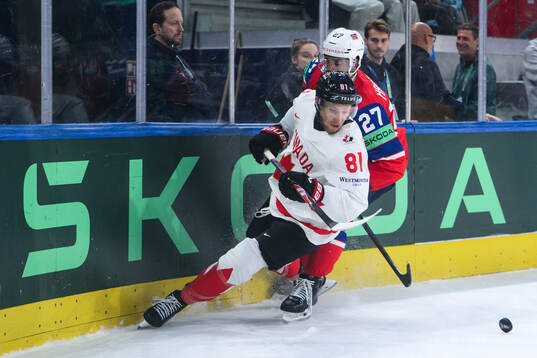 Dylan Holloway of Canada and Andreas Martinsen of Norway