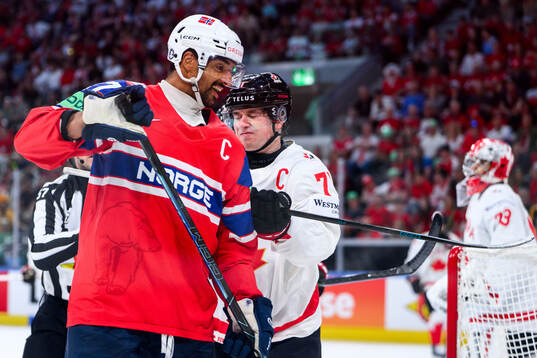 Andreas Martinsen of Norway and Macklin Celebrini of Canada