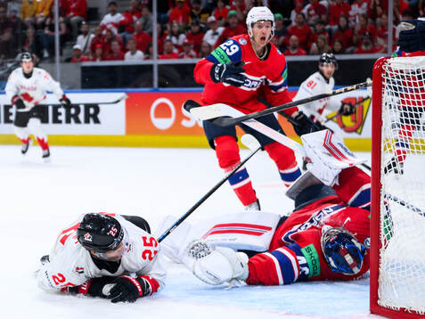 Darnell Nurse of Canada and goaltender Henrik Haukeland of