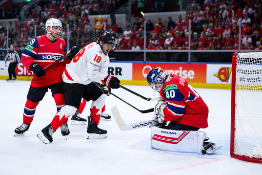 Robert Thomas of Canada and goaltender Henrik Haukeland of