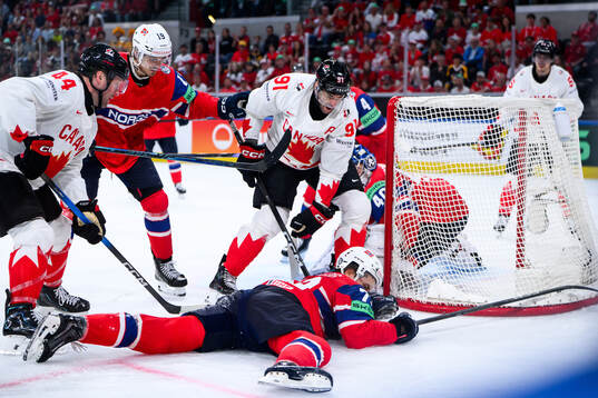 Stian Solberg of Norway and Morgan Rielly and John Tavares