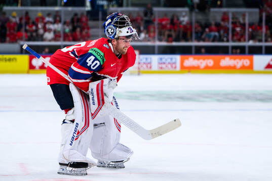 Goaltender Henrik Haukeland of Norway looks dejected