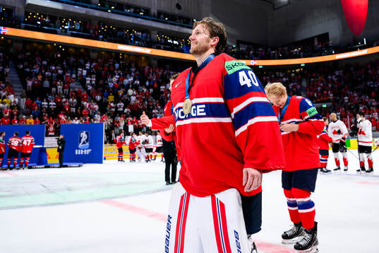 Goaltender Henrik Haukeland of Norway celebrates
