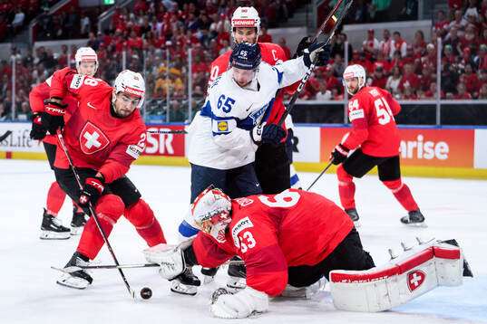 Timo Meier, Roman Josi and Leonardo Genoni of Switzerland