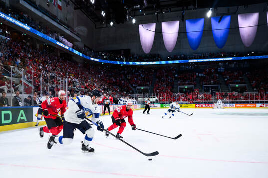 Alexander Barkov of Finland and Christian Marti and Denis