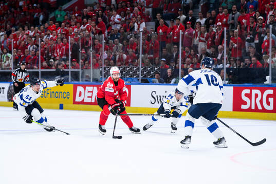 Christoph Bertschy of Switzerland and Mikael Granlund,