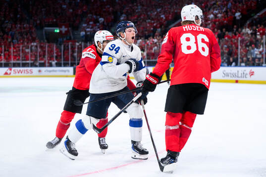 Konsta Helenius of Finland celebrates scoring the winning