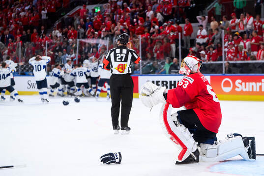 Leonardo Genoni of Switzerland looks dejected