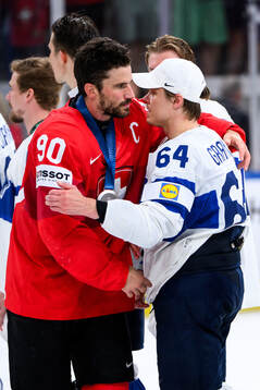 Roman Josi of Switzerland and Mikael Granlund of Finland