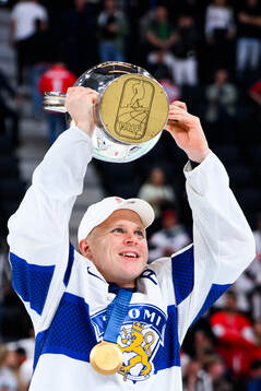 Mikko Lehtonen of Finland celebrates with the trophy