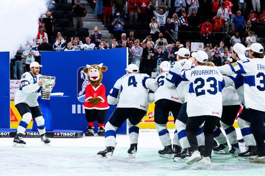 Alexander Barkov of Finland celebrates with the trophy