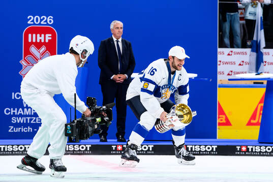 Alexander Barkov of Finland celebrates with the trophy