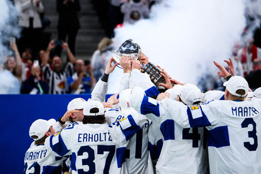 Players of Finland celebrate with the trophy