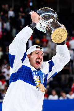 Hannes Björninen of Finland celebrates with the trophy