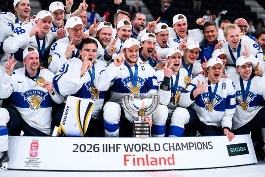 Players of Finland celebrate with the trophy