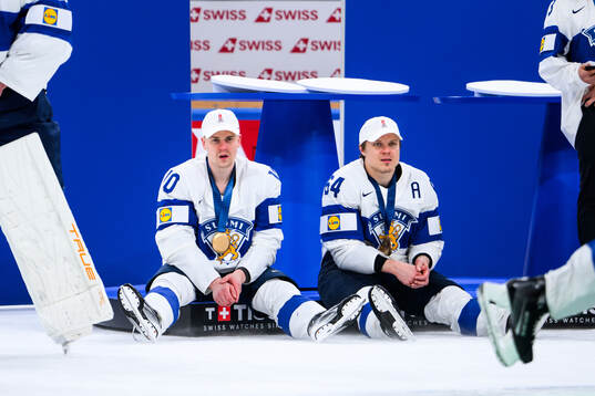 Henri Jokiharju and Mikael Granlund of Finland