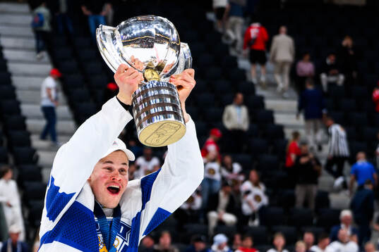 Jesse Puljujärvi of Finland celebrates with the trophy