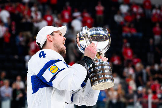 Mikko Lehtonen of Finland celebrates with the trophy