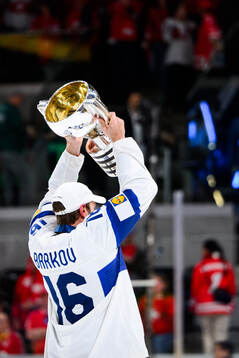 Alexander Barkov of Finland celebrates with the trophy