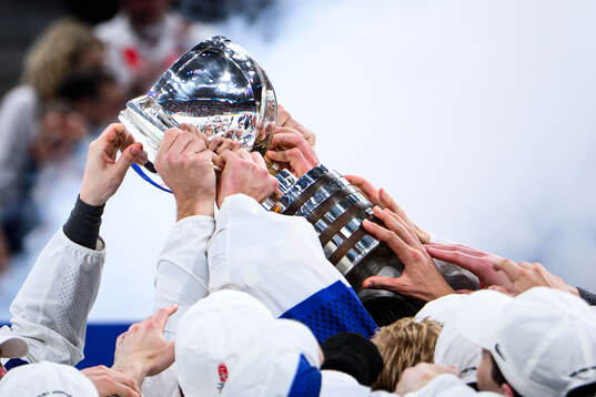 Players of Finland celebrate with the trophy