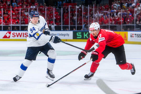 Konsta Helenius of Finland scores the game winning goal