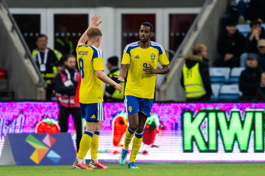 Alexander Isak of Sweden celebrates with Daniel Svensson