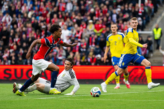 Oscar Bobb of Norway and goalkeeper Jacob Widell