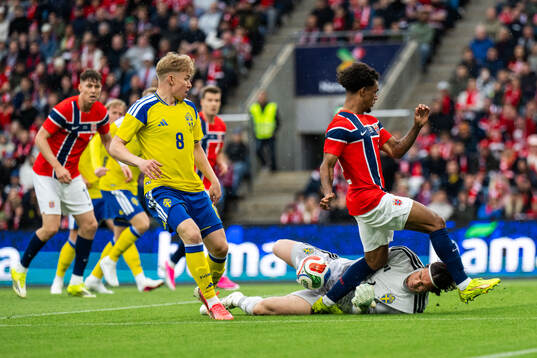 Daniel Svensson and goalkeeper Jacob Widell Zetterström of