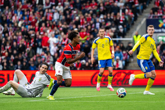 Goalkeeper Jacob Widell Zetterström and Eric Smith of