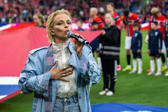 Petra Marklund performs the Swedish national anthem
