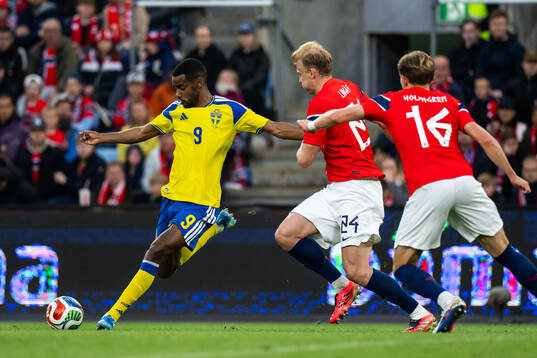 Alexander Isak of Sweden scores 3-1 behind Sondre Langås
