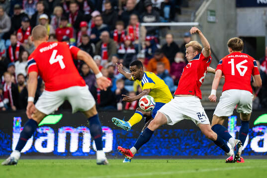 Alexander Isak of Sweden scores 3-1 behind Sondre Langås