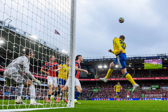 Goalkeeper Jacob Widell Zetterström and Eric Smith of