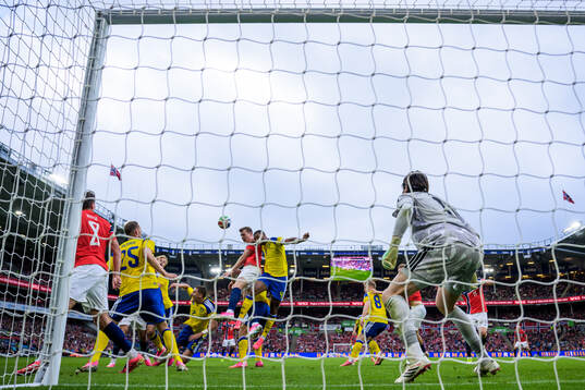 Sander Berge and Alexander Sørloth of Norway challenge