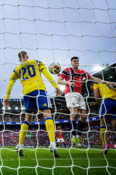 Eric Smith of Sweden touches the ball as Jørgen Strand
