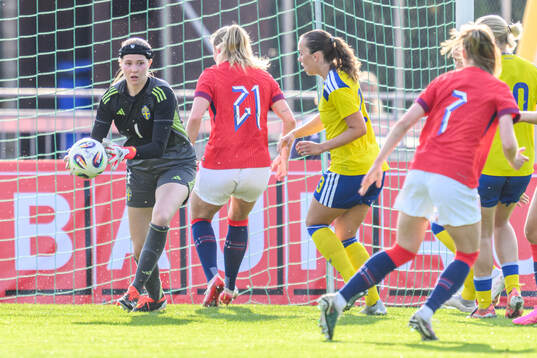 Goalkeeper Elvira Björklund of Sweden and Iris Omarsdottir