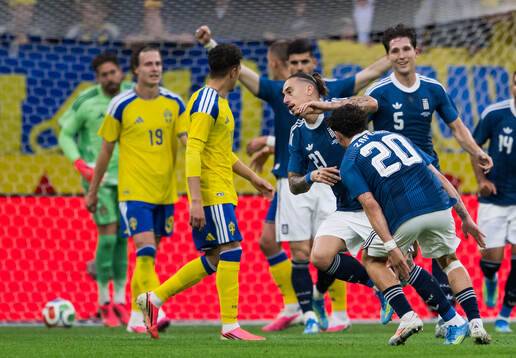 Kostas Tsimikas of Greece celebrates