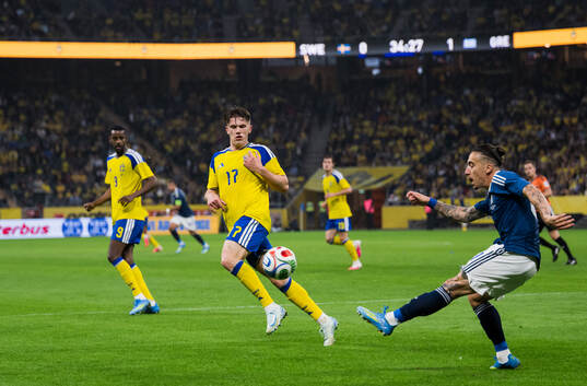 Viktor Gyökeres of Sweden and Kostas Tsimikas of Greece
