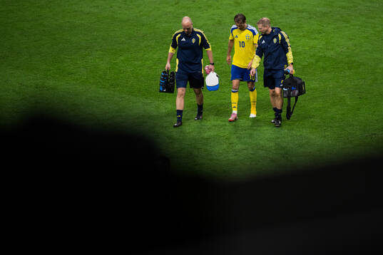 Benjamin Nygren of Sweden leaves the pitch due to injury