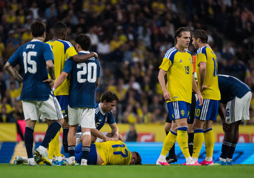 Panagiotis Retsos of Greece with Viktor Gyökeres of Sweden