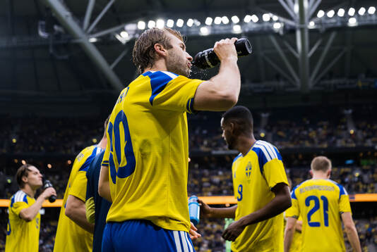 Benjamin Nygren of Sweden drinks
