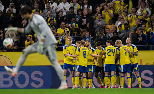 Gustaf Nilsson of Sweden celebrates with team mates