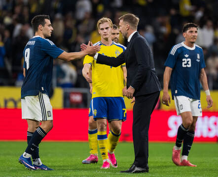 Tasos Douvikas of Greece and Head coach Graham Potter of