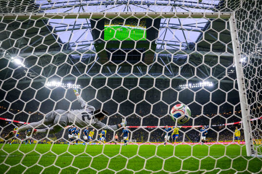 Goalkeeper Kostas Tzolakis of Greece lets in the 1-1 goal