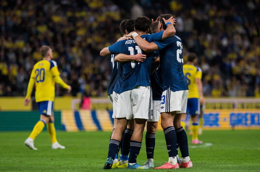 Giorgos Masouras of Greece celebrates with team mates