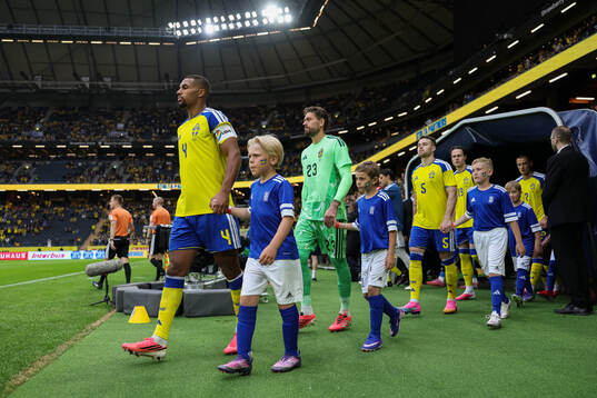 Isak Hien and goalkeeper Kristoffer Nordfeldt of Sweden