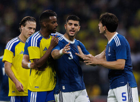 Alexander Isak of Sweden reacts at Tasos Douvikas and