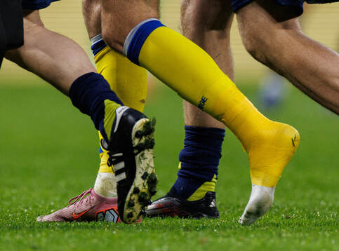 Benjamin Nygren of Sweden with a taped foot