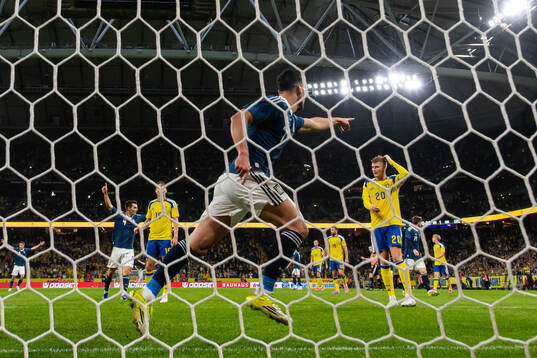 Carl Starfelt and Eric Smith of Sweden look dejected as