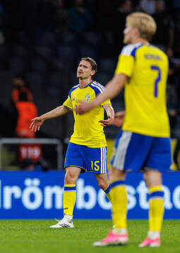 Carl Starfelt of Sweden looks dejected
